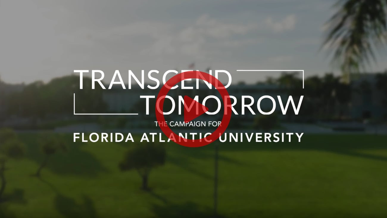 image of a landscape with the words "transcend tomorrow" and a red play button covering