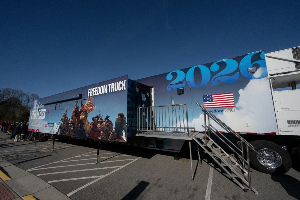 large trailer with 2026 and Freedom truck printed on the side
